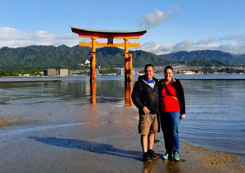 Anne and Tony visiting the floating Torii Gate on Miyajima Island in Japan
