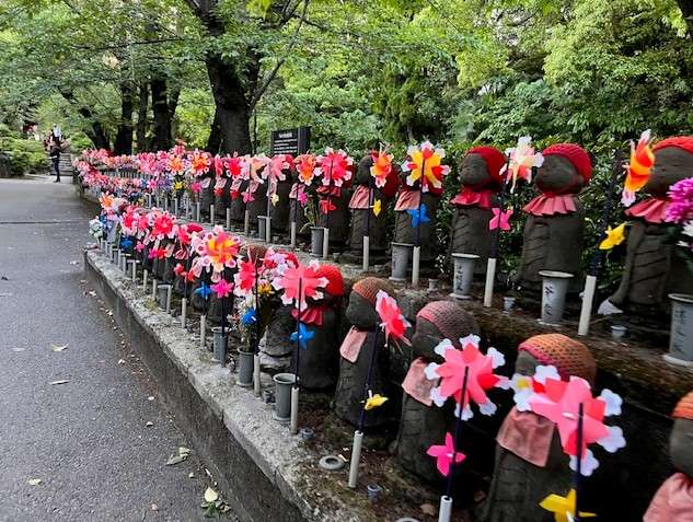 Effigies at Zojoji Temple in Tokyo. You can see the stairs at the back which lead to more rows of statues
