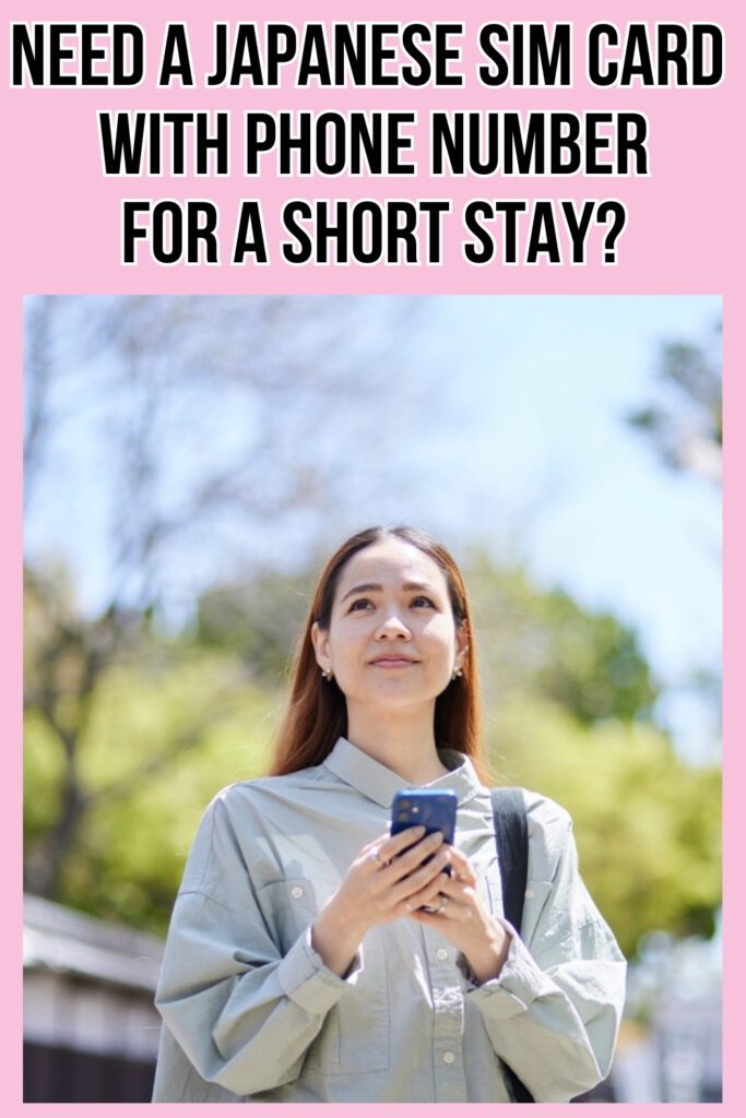 Woman in a light gray shirt holding a phone and looking up thoughtfully while standing outdoors under sunny skies, with spring trees and traditional Japanese rooftops in the background. Text overlay reads "Need a Japanese SIM card with phone number for a short stay?" on a pink background.