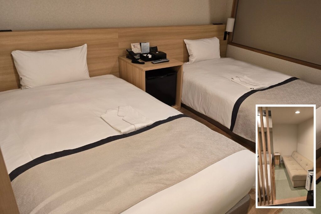 Japanese modern twin room at Tosei Hotel Cocone Ueno Okachimachi with two single beds, timber headboard, shared bedside table, and inset showing a wooden partition screen and seating area.