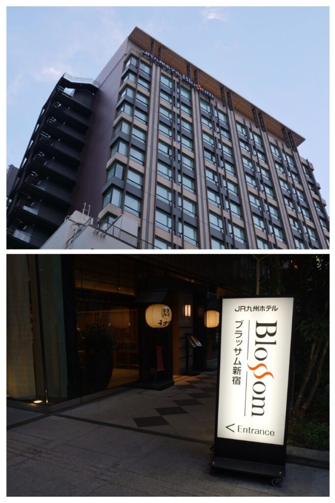 JR Kyushu Hotel Blossom Shinjuku exterior tower and illuminated entrance sign with paper lantern at dusk.