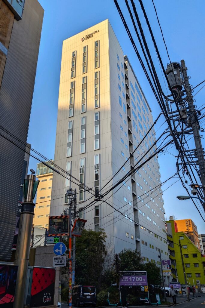 Granbell Hotel Shinjuku tower exterior viewed from street level in the Kabukicho area, Tokyo.